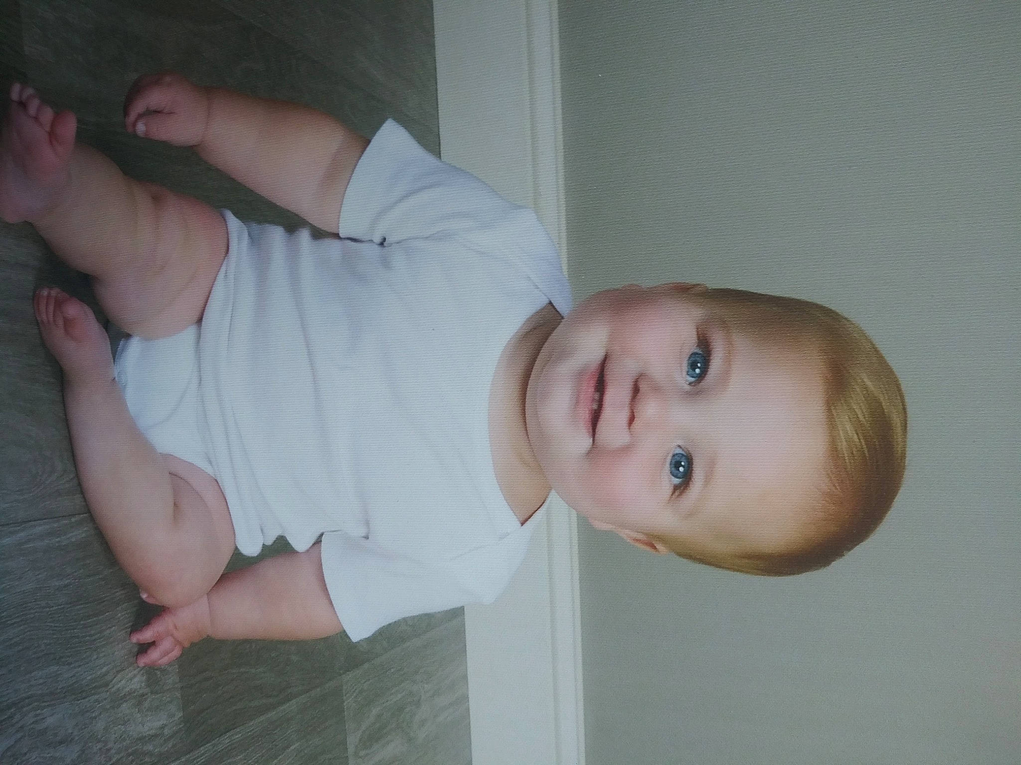 Cole is registered to the contest to win money with this photo: baby_toddler_clothing, cheek, child, dress, elbow, eyelash, flooring, gesture, hand, happy, human_leg, iris, joy, neck, nose, person, skin, sleeve, smile, thumb