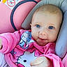Luna is registered to the contest to win money with this photo: baby, infant, child, portrait, smiling, blue_eyes, pink_clothing, car_seat, safety_seat, plush_toy, toy, close_up, indoors, seated, happy, face, head, baby_clothing, colorful, photography