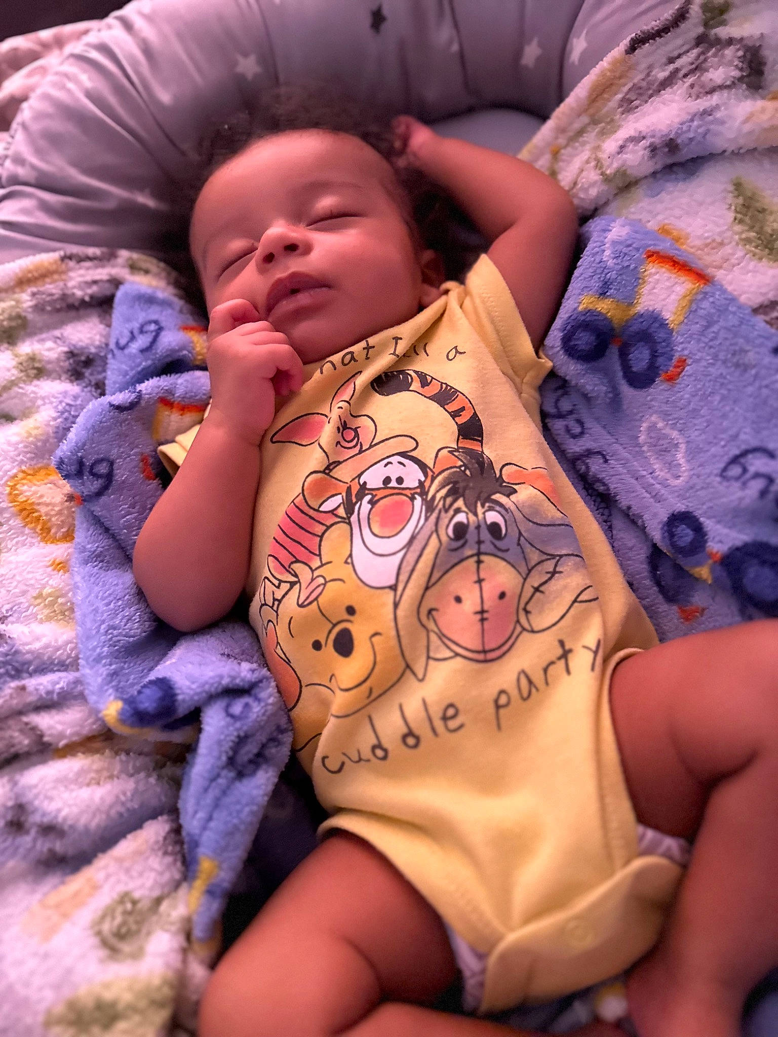 Ares is registered to the contest to win money with this photo: baby, baby_products, baby_sleeping, baby_toddler_clothing, cheek, chest, child, comfort, eye, finger, human_leg, linens, mammal, mouth, person, pink, purple, skin, textile, thigh