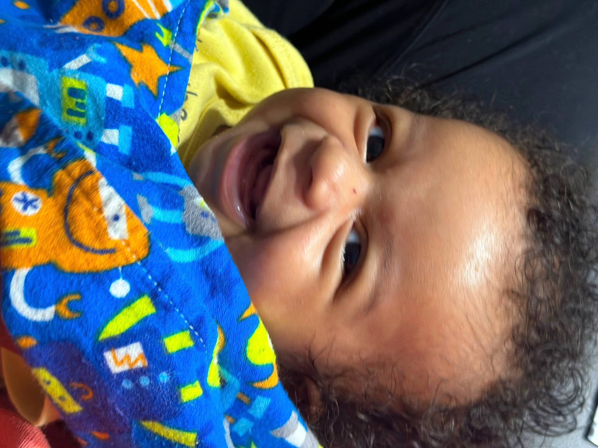 Ares is registered to the contest to win money with this photo: baby, cheek, cool, eyebrow, eyelash, facial_expression, finger, forehead, fun, happy, headgear, iris, lip, mouth, nose, orange, person, skin, smile, toddler