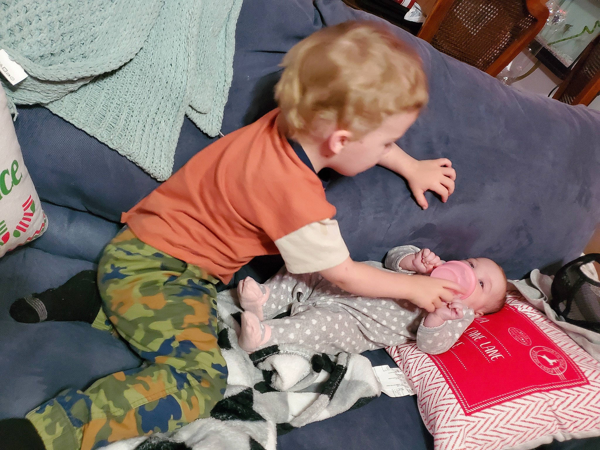 Dakota joined the competition — help win amazing prizes! baby, bag, camouflage, carmine, chair, child, comfort, couch, event, fun, lap, luggage_and_bags, military_camouflage, pattern, person, pillow, play, room, sharing, sitting