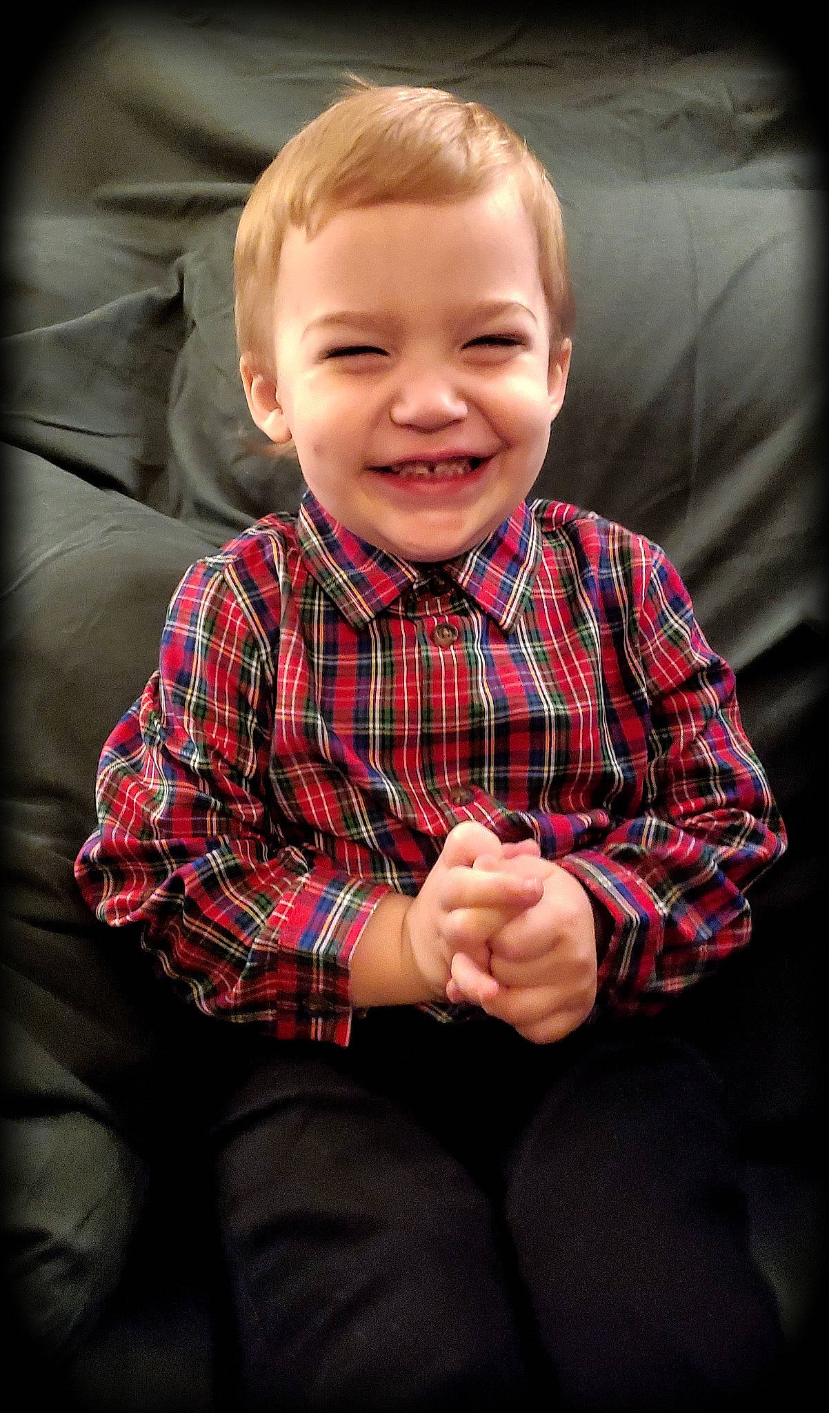 Dakota is registered to the contest to win money with this photo: cheek, child, collar, dress_shirt, eye, face, facial_expression, finger, flash_photography, gesture, hairstyle, happy, joy, outerwear, pattern, person, plaid, sleeve, smile, standing