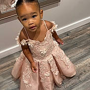 Azalea is registered to the contest to win money with this photo: blackhair, child, clothing, crawling, dress, face, female, formalwear, girl, hair, happy, hardwood, head, person, photography, portrait, sitting, sleeve, standing, wood