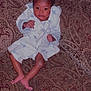 Skylan is registered to the contest to win money with this photo: baby, brown, child, clothing, couch, cute, expression, face, feet, furniture, home, indoor, infant, legs, pattern, person, portrait, robe, sitting, young
