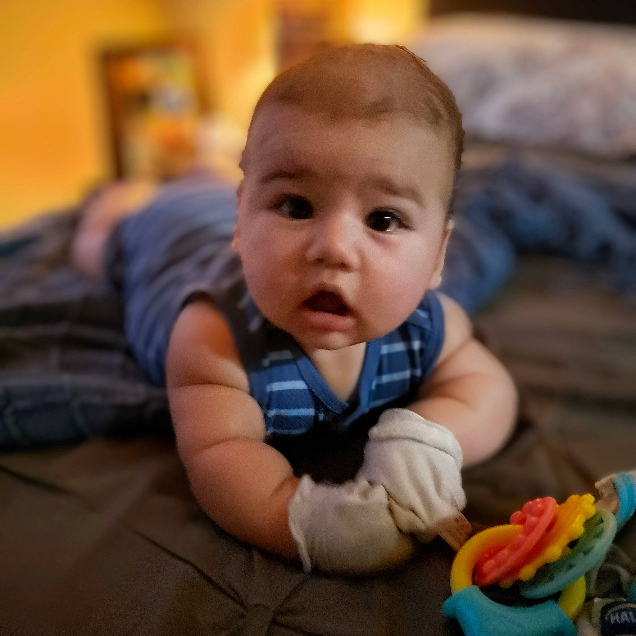 Lucius is registered to the contest to win money with this photo: baby, baby_toddler_clothing, cheek, child, comfort, crawling, flooring, fun, grass, happy, linens, nose, person, portrait_photography, sitting, skin, smile, surprise, thumb, toddler