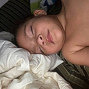 Isabella is registered to the contest to win money with this photo: child, sleeping, bed, blanket, face, pillow, rest, peaceful, indoors, closeup, skin, comfort, relaxation, young, portrait, person, nap, tired, cozy, soft