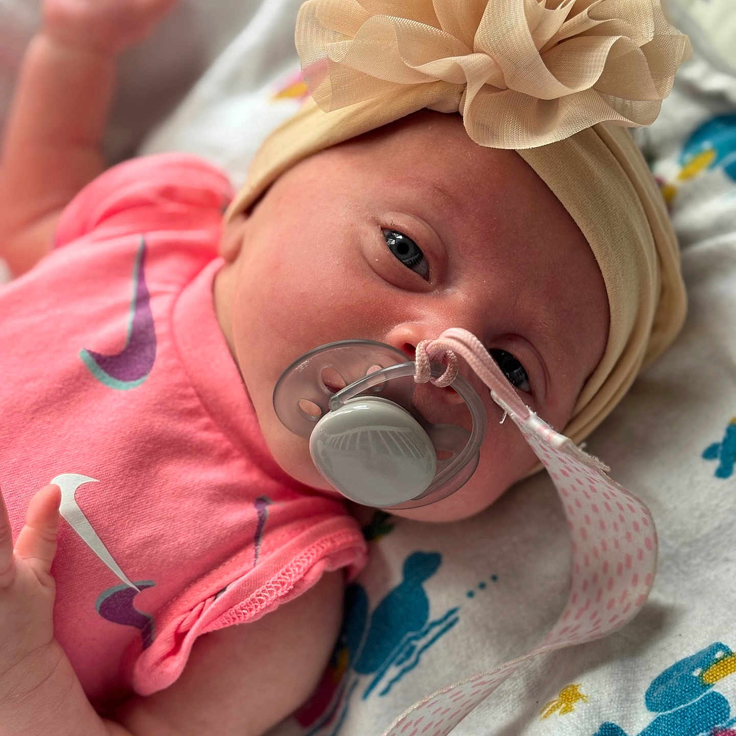 Amiracle is registered to the contest to win money with this photo: baby, bed, bodypart, bonnet, cap, clothing, cutlery, face, finger, furniture, hand, hat, head, newborn, person, photography, portrait, sitting, spoon, t_shirt