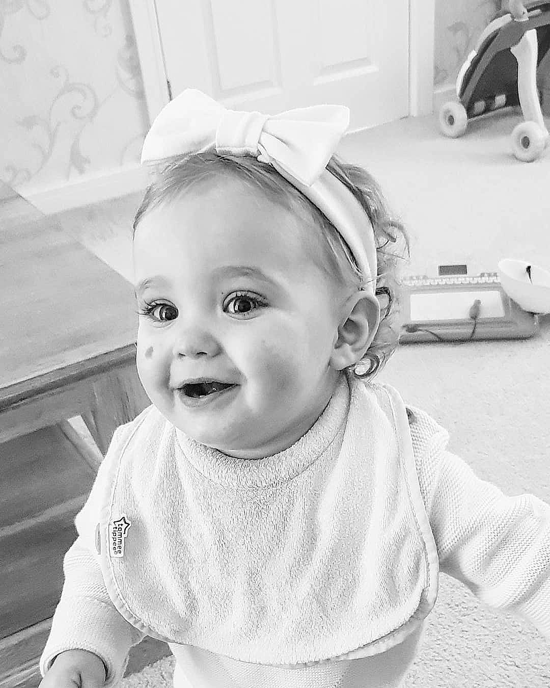 Evie-mae is registered to the contest to win money with this photo: beauty, black_and_white, cheek, child, eye, face, facial_expression, girl, hair_accessory, head, headgear, infant, monochrome_photography, person, photograph, photography, skin, smile, toddler, white