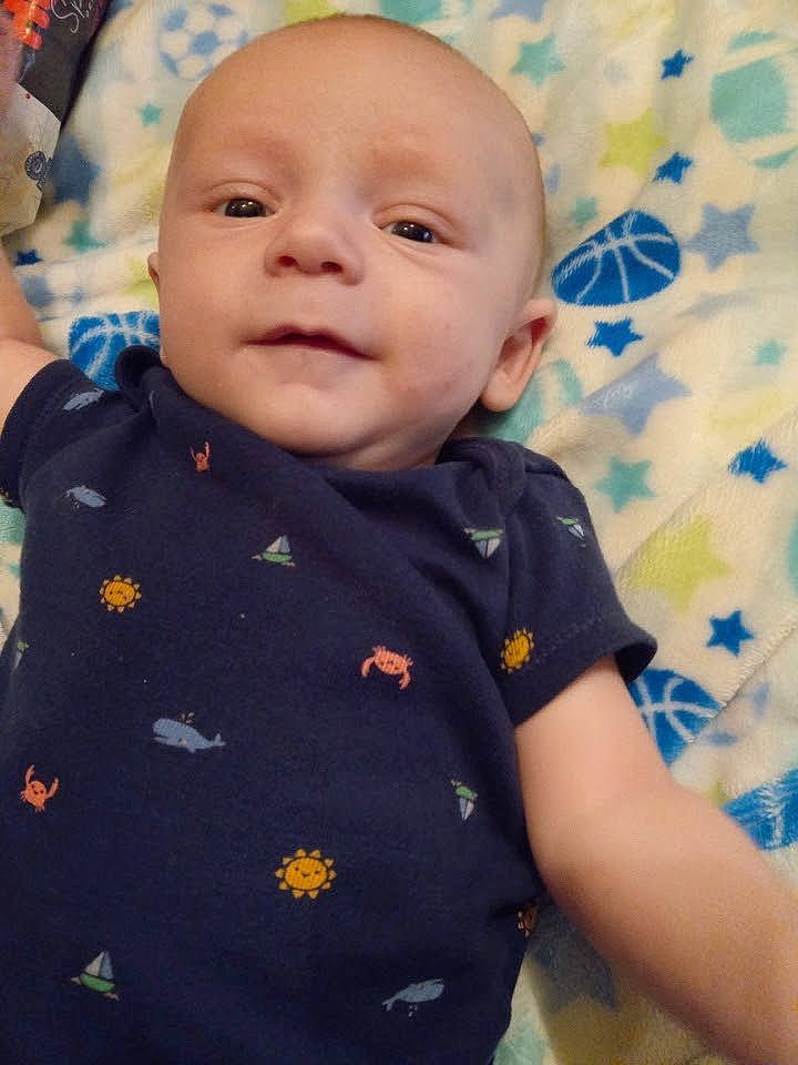 Legend is registered to the contest to win money with this photo: baby, baby_laughing, baby_toddler_clothing, cheek, child, collar, electric_blue, eye, fun, happy, iris, nose, pattern, person, portrait_photography, sitting, skin, sleeve, smile, t_shirt