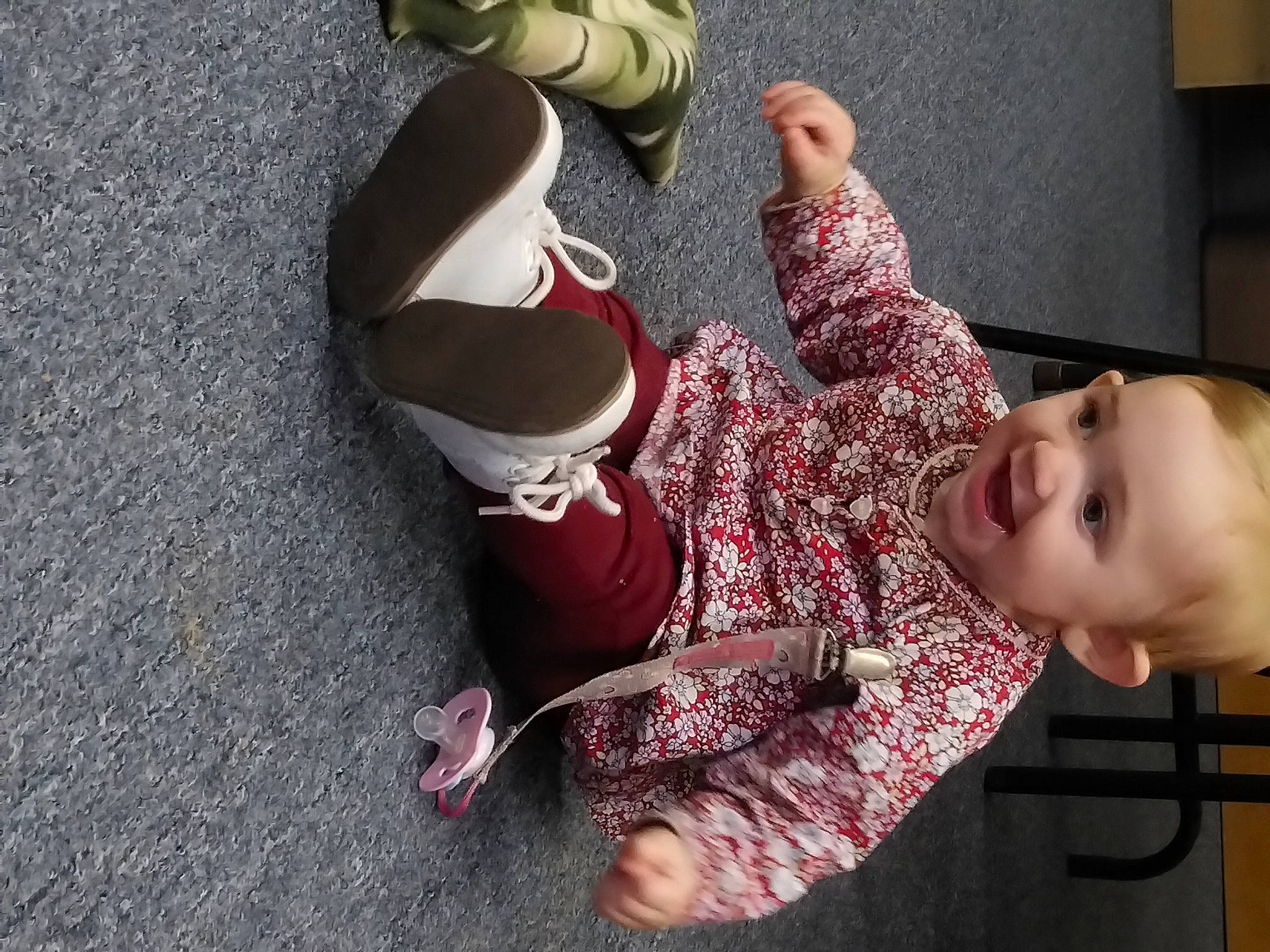 Heaven is registered to the contest to win money with this photo: baby, carmine, child, dress, eye, finger, flooring, foot, fun, happy, human_leg, joy, knee, nail, outdoor_shoe, pattern, person, sandal, sitting, thigh