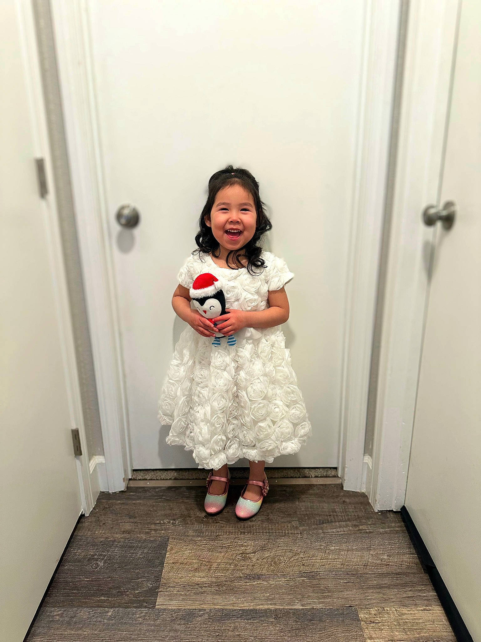 Elia is registered to the contest to win money with this photo: baby_toddler_clothing, child, day_dress, door, dress, event, fashion_design, flooring, fun, happy, home_door, joy, leg, one_piece_garment, pattern, person, room, sandal, sleeve, smile