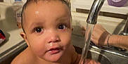 Skyler joined the competition — help win amazing prizes! baby, infant, child, sink, kitchen_sink, faucet, water, wet_hair, bath, toy, playing, hand, soap_bottle, tiles, window, countertop, closeup, portrait, expression, splash