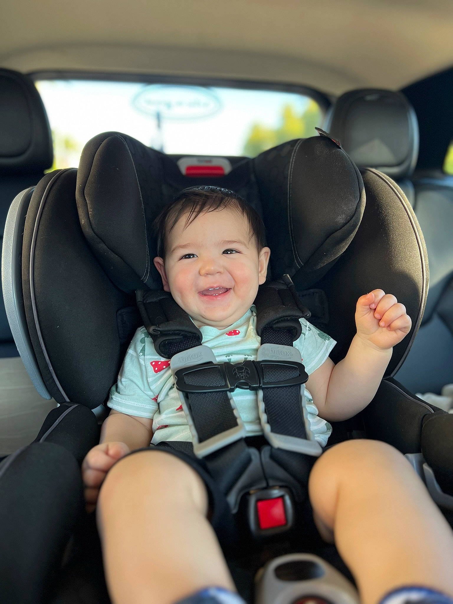 Kaiden is registered to the contest to win money with this photo: arm, auto_part, automotive_design, automotive_exterior, car, car_seat, car_seat_cover, comfort, head_restraint, joy, leg, motor_vehicle, person, personal_luxury_car, seat_belt, smile, steering_part, steering_wheel, toddler, vehicle