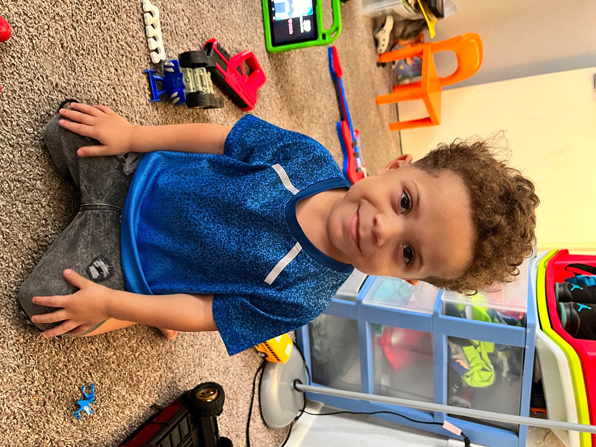 Dakari joined the competition — help win amazing prizes! automotive_exterior, child, denim, electric_blue, engineering, fun, happy, human_leg, joy, leisure, motor_vehicle, pattern, person, play, recreation, service, smile, t_shirt, tire, toddler