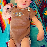 Dawsonn Blake is registered to the contest to win money with this photo: adorable, arms, baby, blanket, child, clothing, cute, face, filter, head, human, indoors, infant, legs, lying_down, onesie, patterned_blanket, pink_hearts, skin, small_baby