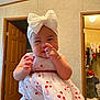 baby, child, indoor, dress, headband, white, red, hand, pointing, smiling, person, room, door, closet, clothing, furniture, portrait, cute, happy, infant