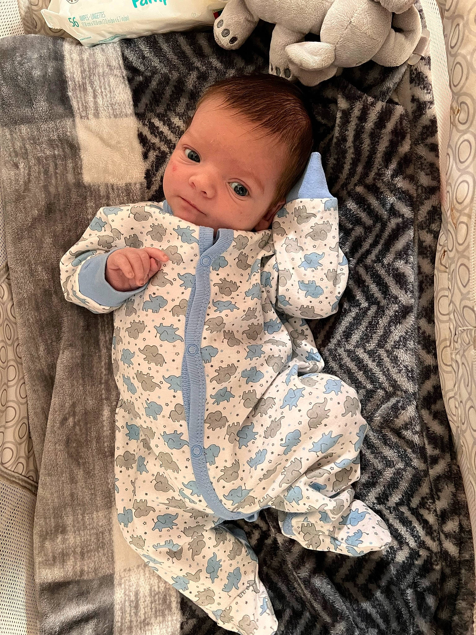 Jonah is registered to the contest to win money with this photo: arm, baby, baby_toddler_clothing, camouflage, cheek, collar, comfort, eye, face, hairstyle, happy, head, human_body, military_camouflage, pattern, person, product, skin, sleeve, textile