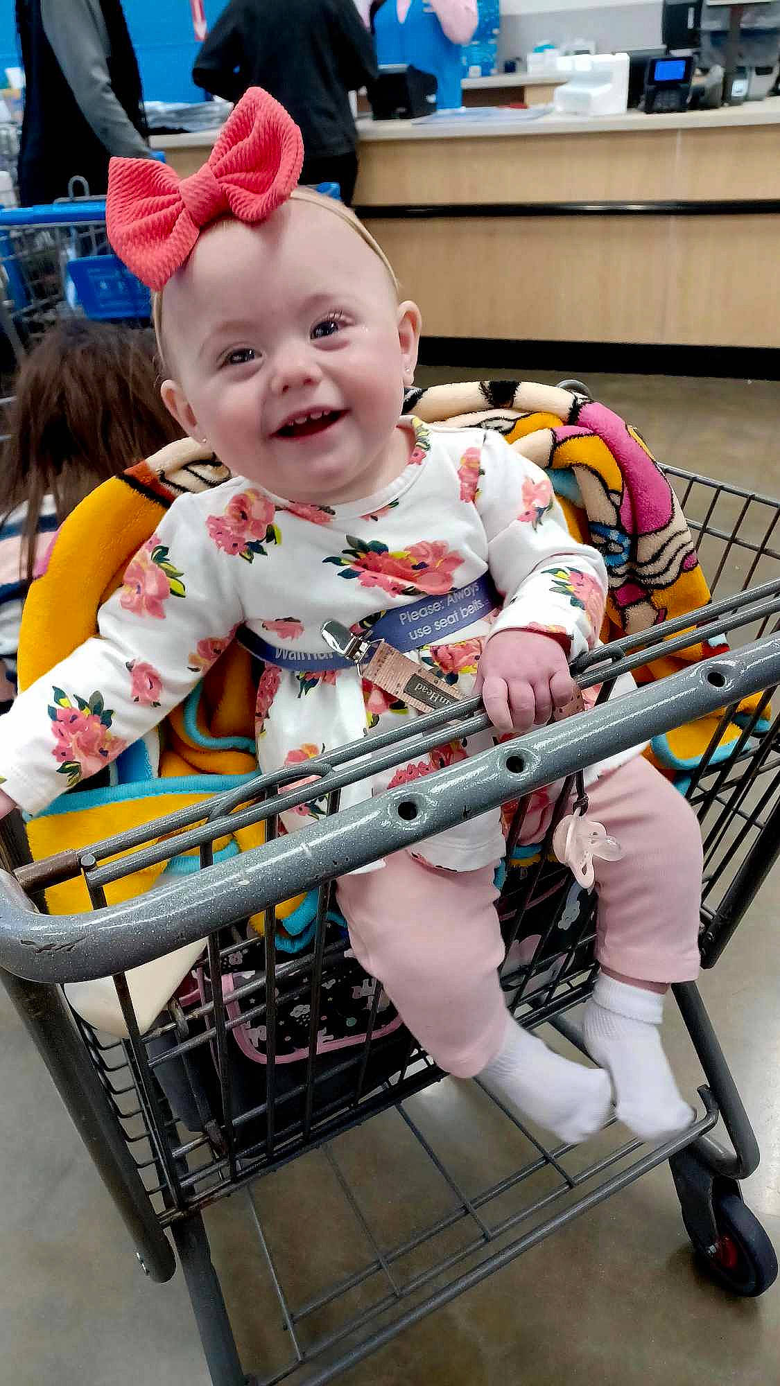 Delilah joined the competition — help win amazing prizes! baby, baby_products, baby_toddler_clothing, child, event, fun, happy, human_leg, joy, machine, pattern, person, photograph, pink, product, shopping_cart, sitting, sleeve, smile, t_shirt
