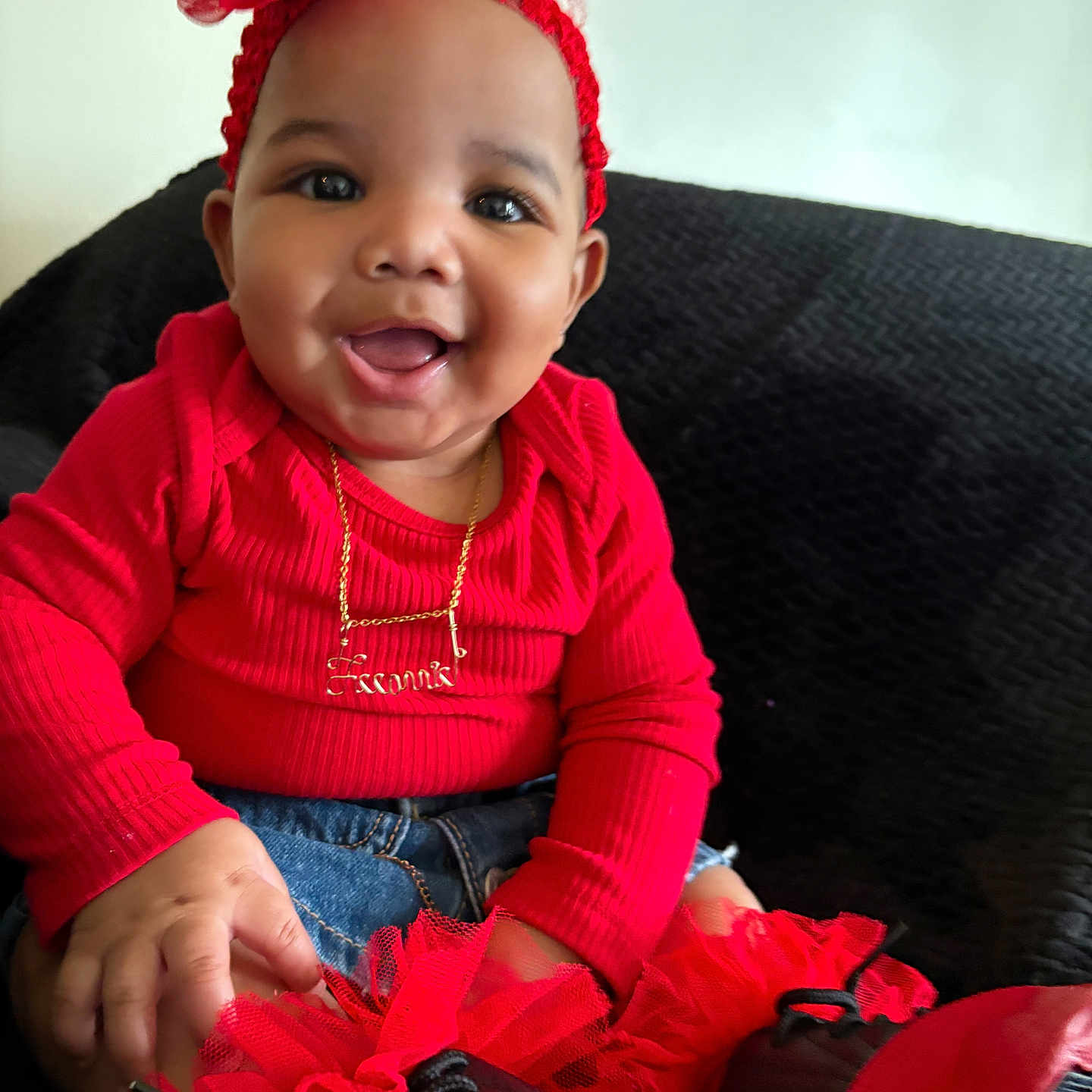 Leeonnie joined the competition — help win amazing prizes! accessory, baby, black_background, child, couch, cute, face, flower, gold_necklace, hand, happy, headband, indoors, jeans, portrait, red_clothing, shoes, sitting, smiling, tutu