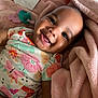 Leeonnie is registered to the contest to win money with this photo: baby, smiling, blanket, pacifier, floral_clothing, infant, happy, cute, child, portrait, indoors, soft_texture, pink_blanket, closeup, lying_down, comfort, adorable, peaceful, baby_girl, colorful