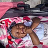 Levyn joined the competition — help win amazing prizes! baby, infant, blanket, stroller, headband, bib, smile, happy, child, outdoor, sunlight, skin, clothing, hands, face, person, cute, lying_down, cozy, toddler