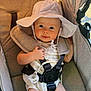 Briella is registered to the contest to win money with this photo: baby, child, stroller, hat, sunhat, seatbelt, cute, infant, outdoor, comfort, safety, smile, skin, clothing, straps, seat, happy, face, portrait, young
