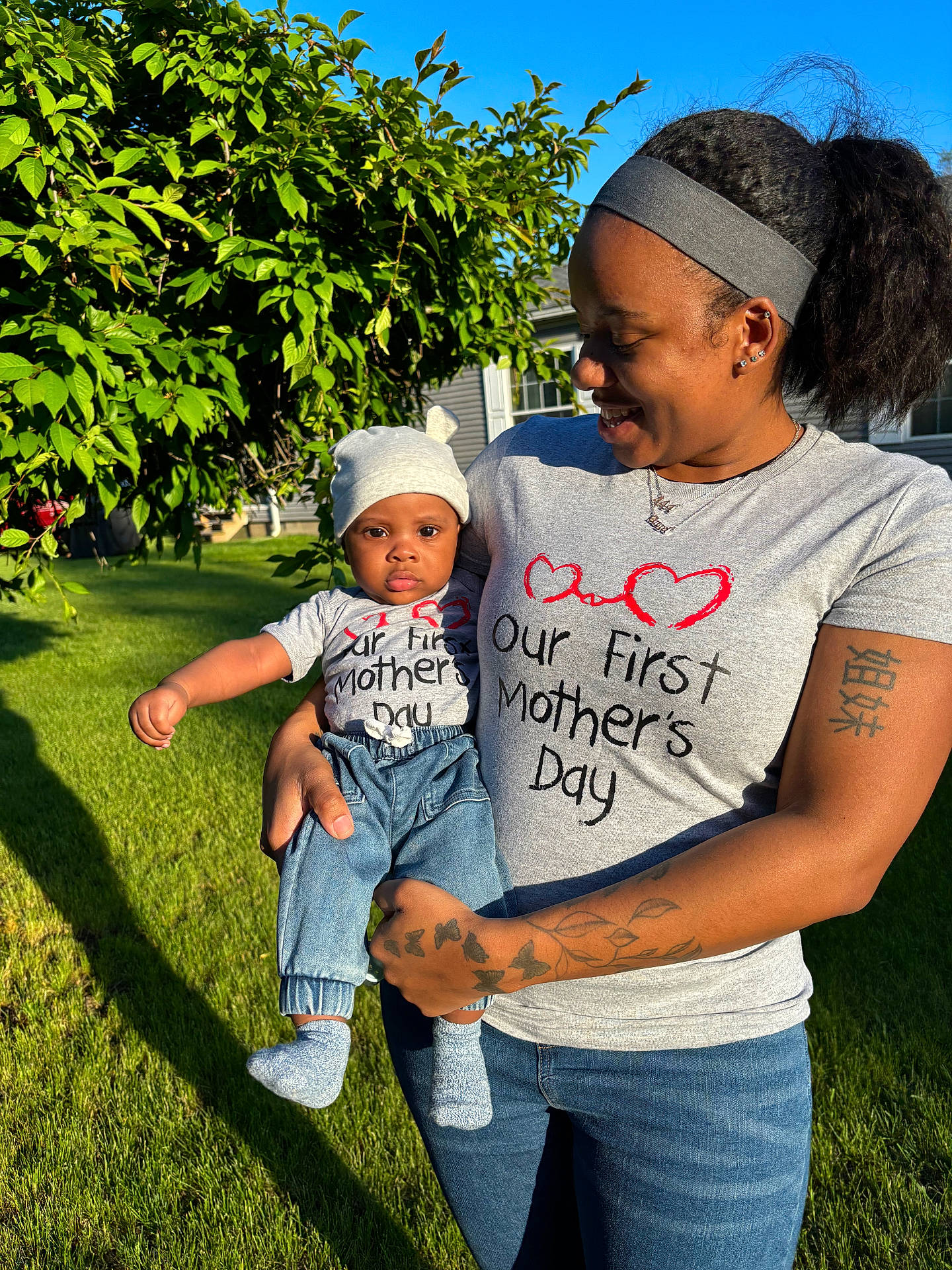 Benjamin joined the competition — help win amazing prizes! baby, clothing, face, grass, hat, head, hosiery, jeans, nature, outdoors, pants, park, person, photography, plant, portrait, skin, sock, t_shirt, tattoo