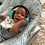 Benjamin joined the competition — help win amazing prizes! baby, bed, bodypart, clothing, couch, crib, cushion, electronics, face, finger, furniture, hand, head, headphones, homedecor, infantbed, person, photography, portrait, t_shirt