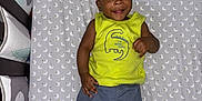 Benjamin is registered to the contest to win money with this photo: bed, boy, child, clothing, crib, face, furniture, head, homedecor, indoors, infantbed, male, pants, person, photography, portrait, shorts, sleeve, standing, t_shirt