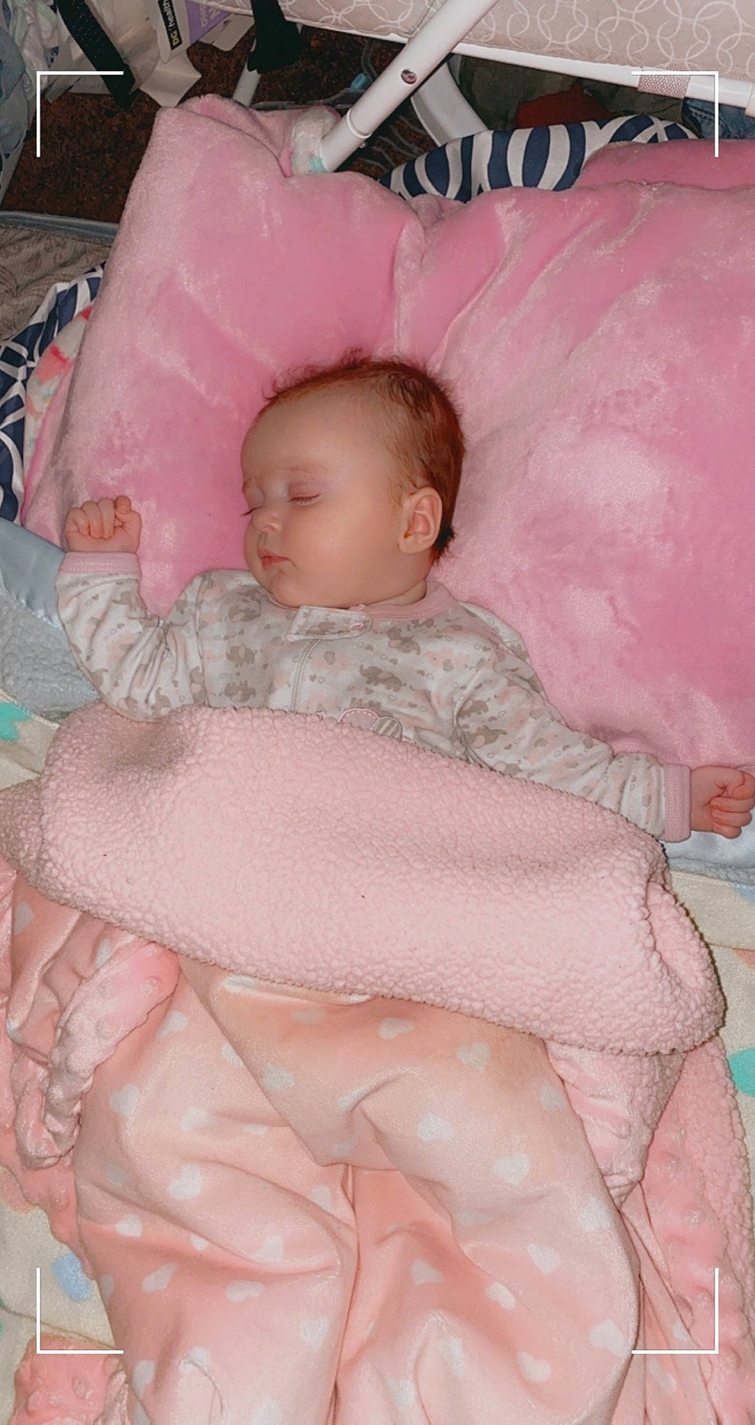 Raelynn joined the competition — help win amazing prizes! baby, baby_products, baby_safety, baby_sleeping, baby_toddler_clothing, cheek, child, comfort, eye, facial_expression, infant_bed, linens, pattern, person, pink, sitting, skin, sleeve, stomach, textile