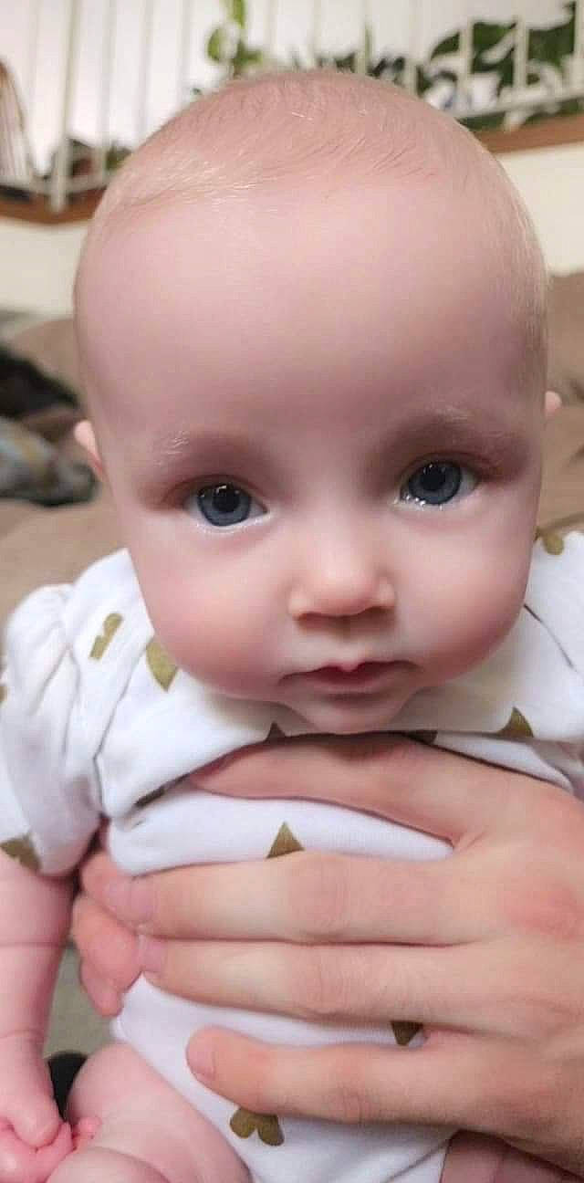 Jade is registered to the contest to win money with this photo: baby, baby_toddler_clothing, cheek, child, chin, ear, eyebrow, eyelash, facial_expression, finger, gesture, iris, lip, mouth, nail, nose, person, skin, sleeve, thumb