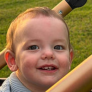 Janson joined the competition — help win amazing prizes! baby, child, clothing, cute, ear, eyes, face, grass, hair, happy, outdoor, person, portrait, skin, smiling, stroller, sunlight, sweater, teeth, toddler