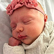 Hazel is registered to the contest to win money with this photo: baby, blanket, child, closeup, clothing, cozy, cute, face, flower, hand, headband, infant, newborn, peaceful, pink, portrait, rest, skin, sleeping, soft