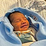 newborn, baby, smiling, wrapped, blanket, blue, infant, sleeping, cute, cozy, knit, soft, child, portrait, clothing, dinosaur, happy, resting, indoors, peaceful