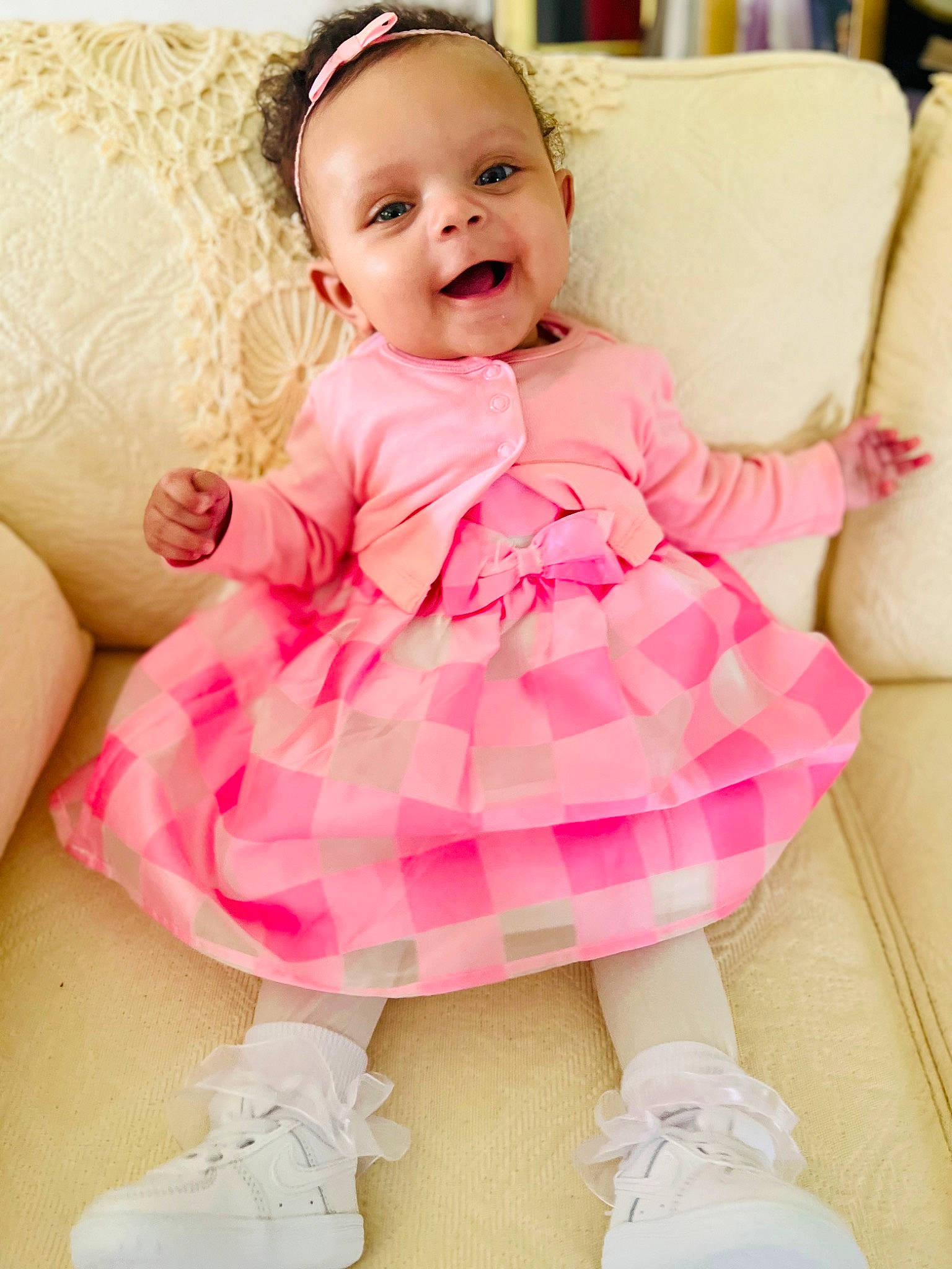 Heavenly Mae is registered to the contest to win money with this photo: baby, baby_toddler_clothing, blond, cheek, child, day_dress, embellishment, fashion_accessory, happy, magenta, pattern, person, pink, purple, shoe, skin, sleeve, smile, sock, toddler