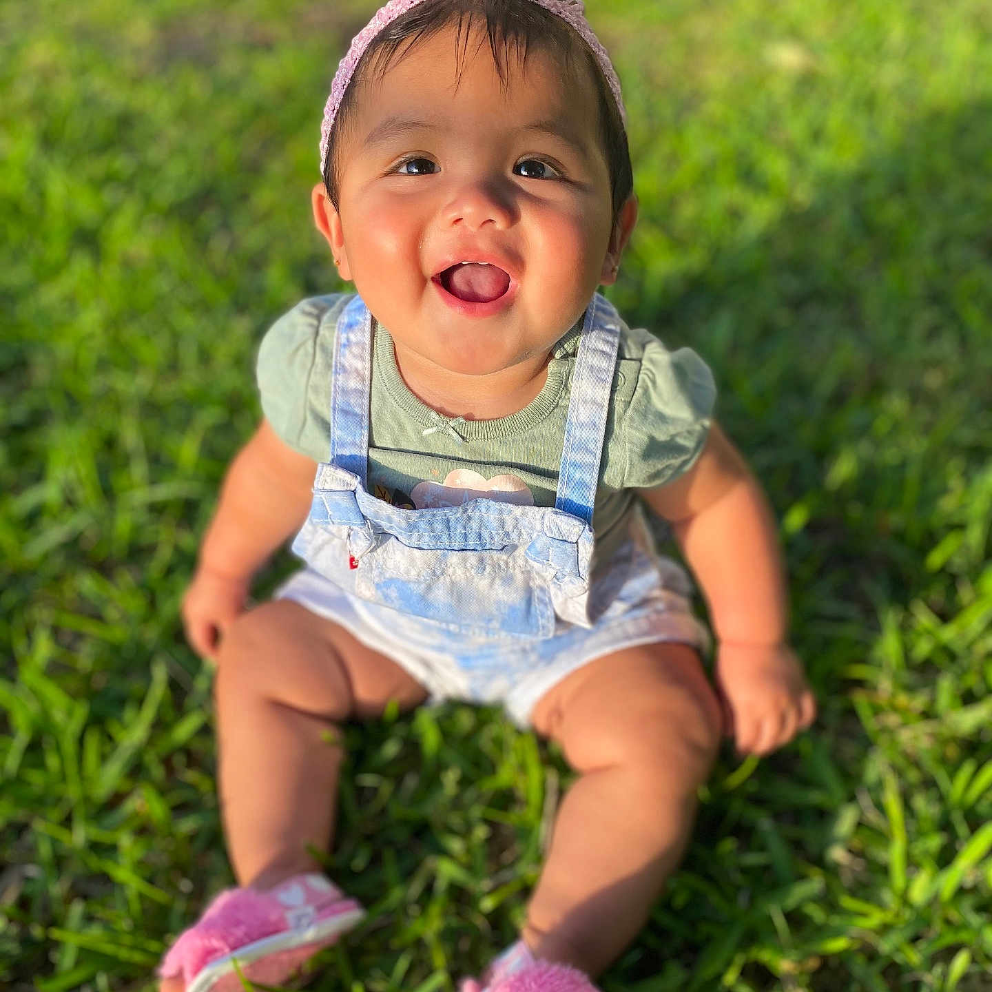 Yaretzi is registered to the contest to win money with this photo: baby, babylaughing, clothing, dress, face, footwear, grass, happy, head, laughing, lawn, outdoors, pants, person, photography, plant, portrait, shoe, shorts, sitting