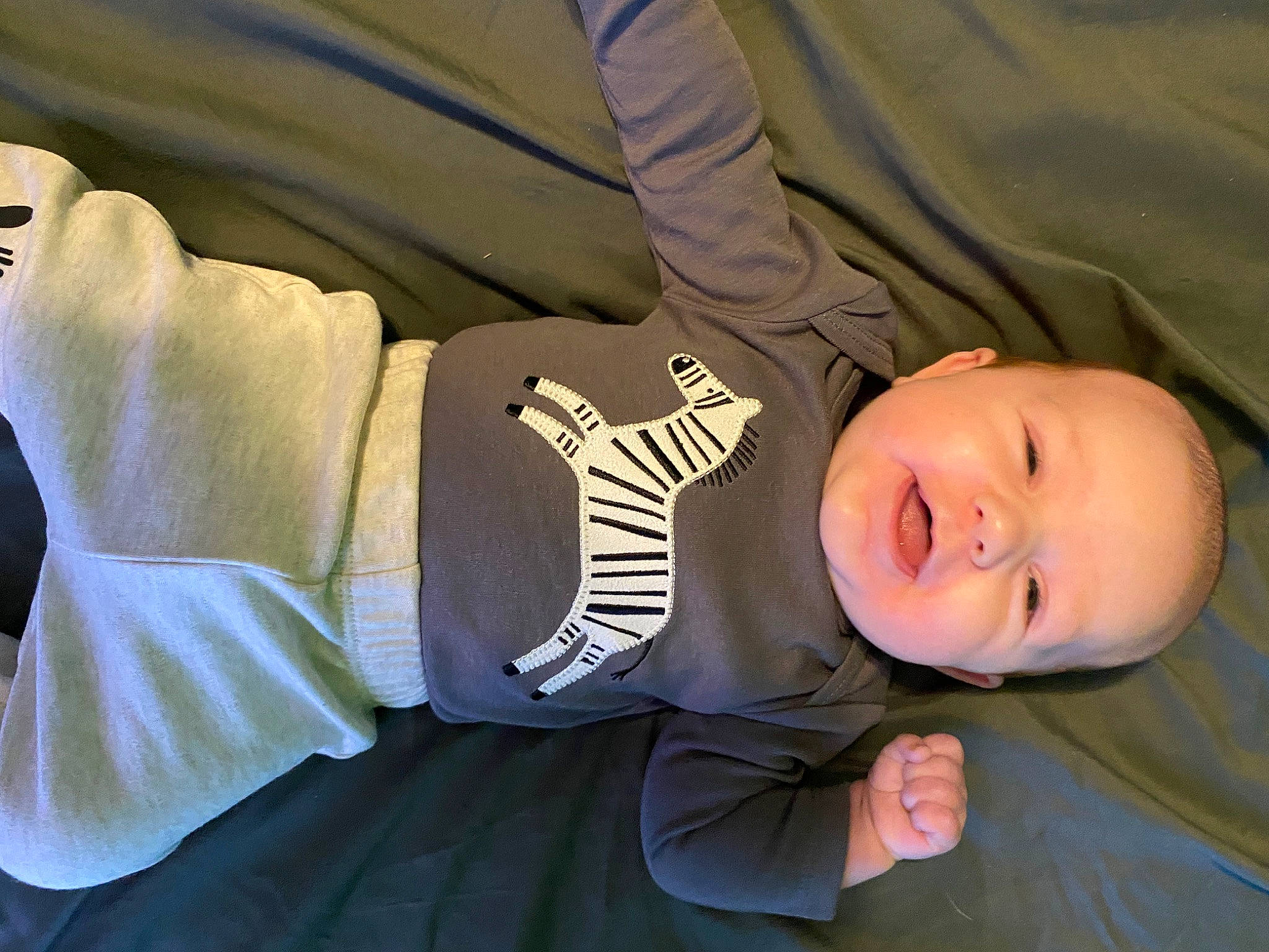 Langston is registered to the contest to win money with this photo: baby, baby_toddler_clothing, child, comfort, cool, elbow, finger, gesture, hand, happy, headgear, human_body, leg, mammal, person, skin, sleeve, smile, toddler, vertebrate