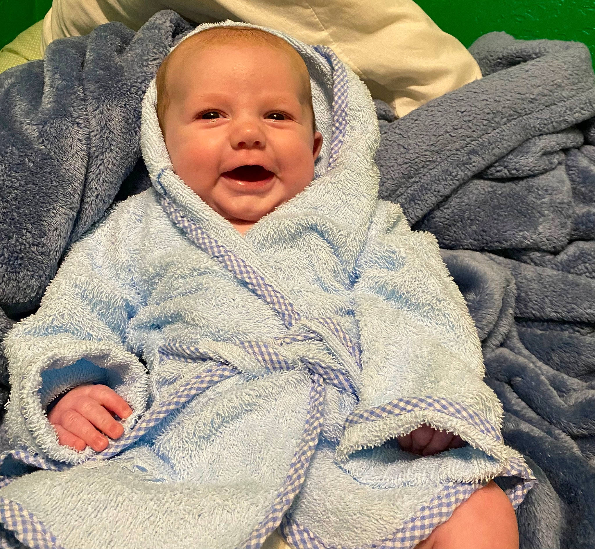 Langston is registered to the contest to win money with this photo: baby, baby_products, baby_sleeping, baby_toddler_clothing, cheek, collar, comfort, eye, face, happy, head, headgear, linens, nose, outerwear, person, skin, sleeve, smile, textile