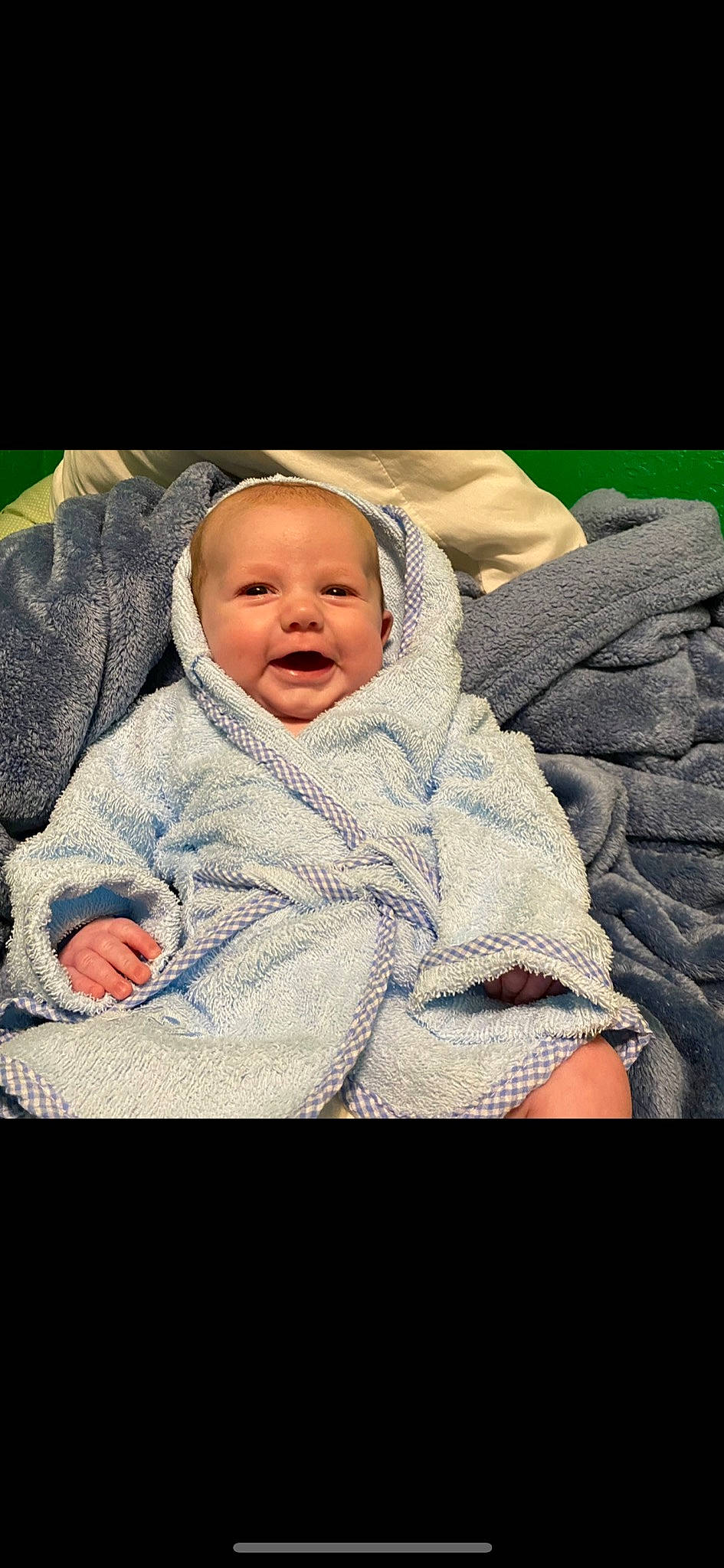 Langston is registered to the contest to win money with this photo: baby, baby_products, baby_toddler_clothing, cheek, child, chin, comfort, eye, face, facial_expression, flash_photography, grass, happy, head, iris, outerwear, person, skin, sleeve, smile