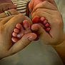 Shane joined the competition — help win amazing prizes! baby_feet, adult_hands, newborn, tiny_toes, skin_texture, close_up, gentle_touch, family, love, care, warmth, human, fingers, foot, infant, parental_care, bond, soft_skin, protection, intimacy
