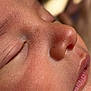 Shane is registered to the contest to win money with this photo: baby, close_up, face, sleeping, skin, nose, lips, eyelashes, infant, peaceful, soft_light, portrait, child, newborn, human, cute, calm, rest, detail, natural