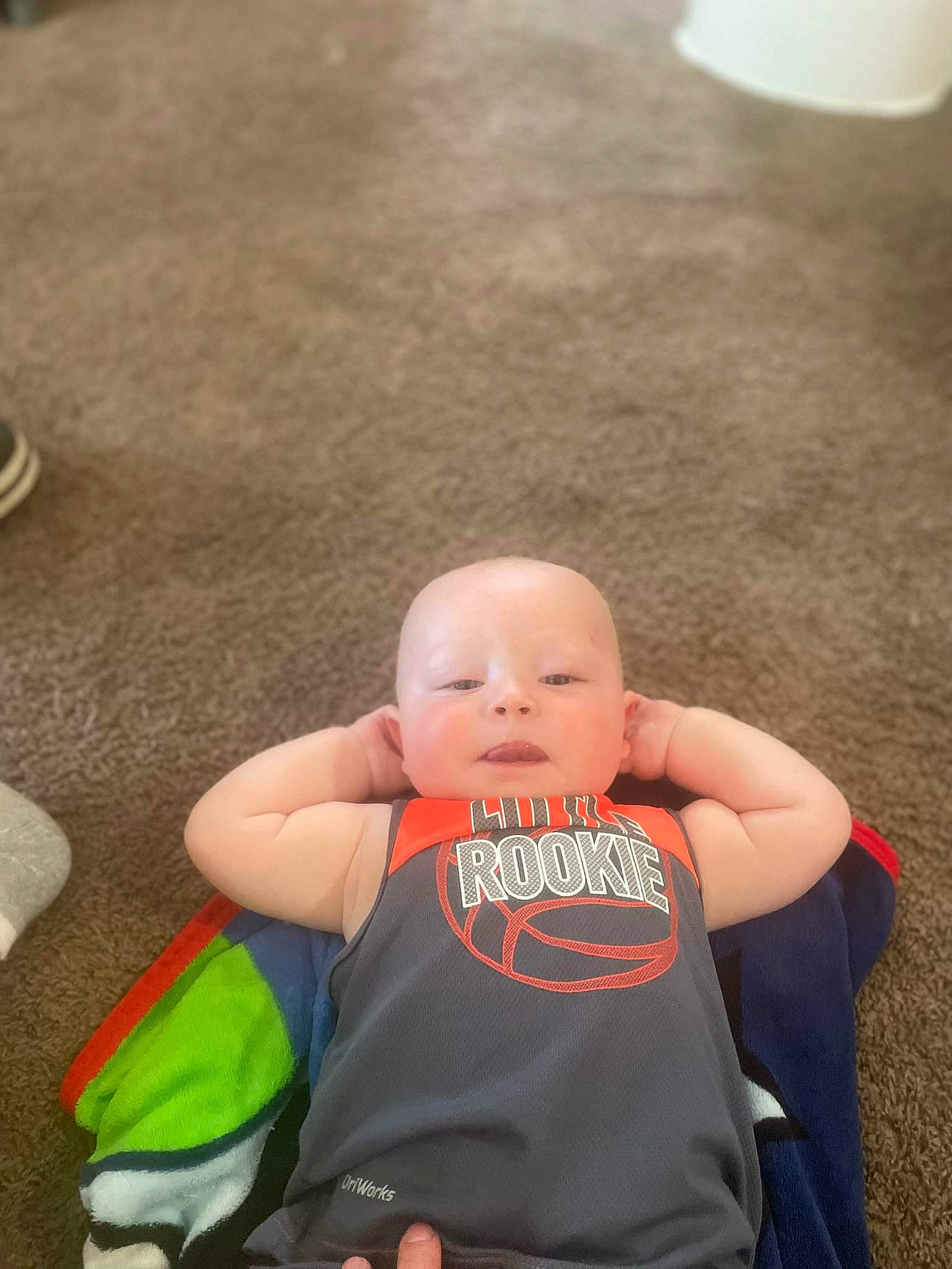 Rowan is registered to the contest to win money with this photo: abdomen, baby, baby_carriage, baby_products, baby_toddler_clothing, chair, cheek, child, facial_expression, fun, grass, happy, head, human_leg, lap, leisure, person, plant, skin, thigh