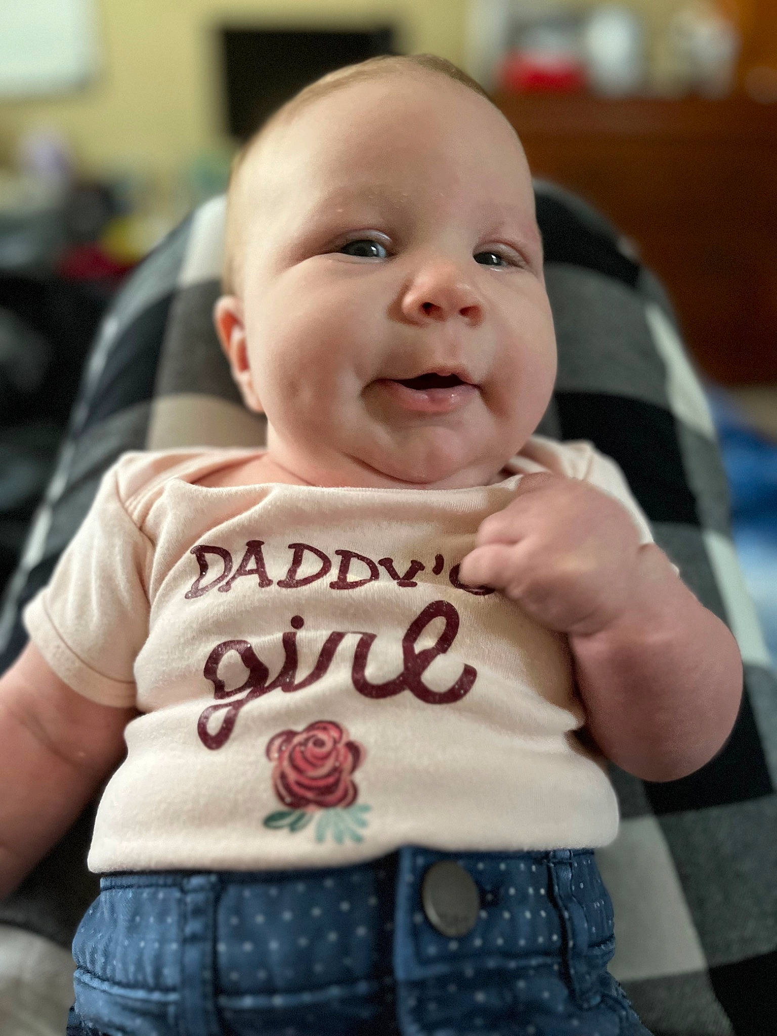 Charlotte joined the competition — help win amazing prizes! baby, baby_products, baby_toddler_clothing, cheek, child, denim, fun, happy, lip, logo, mouth, pattern, person, portrait_photography, sitting, skin, sleeve, smile, t_shirt, toddler
