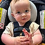 baby, child, car_seat, blue_eyes, plush_toy, hands, clothing, seatbelt, infant, cute, closeup, indoor, person, headrest, straps, soft_toy, expression, skin, sitting, young