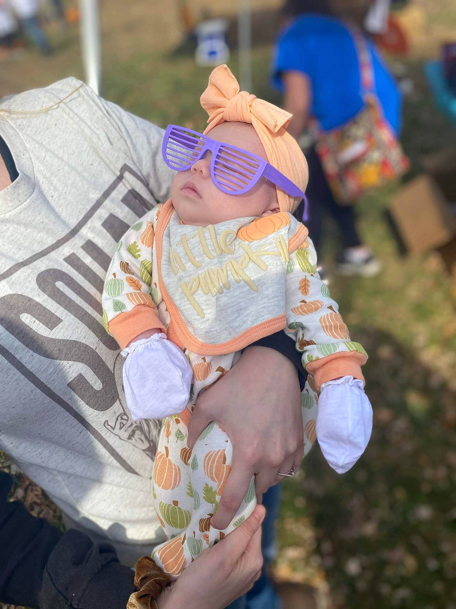 Lilyanna joined the competition — help win amazing prizes! costume, event, eyewear, fashion_accessory, fun, glasses, goggles, grass, hat, human_leg, jewellery, leisure, person, recreation, shorts, sitting, sun_hat, sunglasses, thigh, toddler