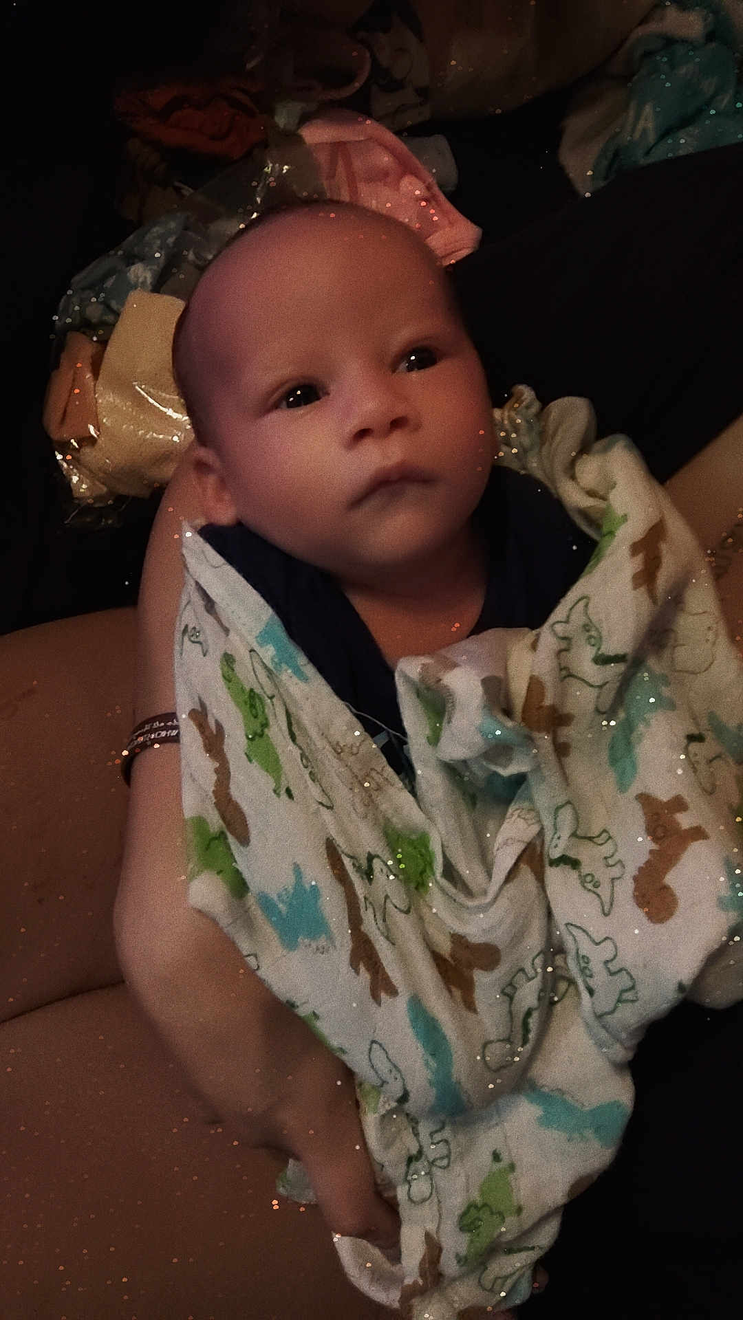 Jaquaruis is registered to the contest to win money with this photo: baby, infant, blanket, animal_print, wrapped, human, child, newborn, face, eyes, hand, skin, person, caring, comfort, soft, cute, resting, indoors, warm