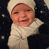 Cory joined the competition — help win amazing prizes! baby, blanket, cheeks, child, closeup, cozy, cute, expression, face, happy, hat, indoor, infant, mittens, newborn, portrait, smile, stars, warm, white_clothing