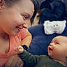 Cory is registered to the contest to win money with this photo: affection, baby, casual_clothing, closeup, connection, emotion, face, family, hand, happy, head, indoor, infant, interaction, joy, love, portrait, skin, smile, woman