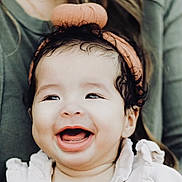 Azari is registered to the contest to win money with this photo: baby, babylaughing, clothing, coat, face, happy, head, jacket, laughing, person, photography, portrait, smile