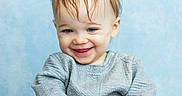 Zander joined the competition — help win amazing prizes! baby, basket, blue_background, casual, child, clothing, cute, expression, face, happy, indoor, light_skin, long_sleeve, portrait, sitting, small_hands, smiling, toddler, wet_hair, young